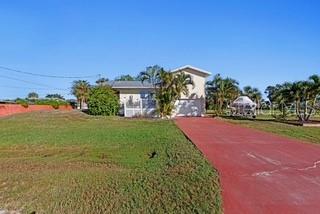 Single Family Residence em PUNTA GORDA, FL - Daniel Dourado