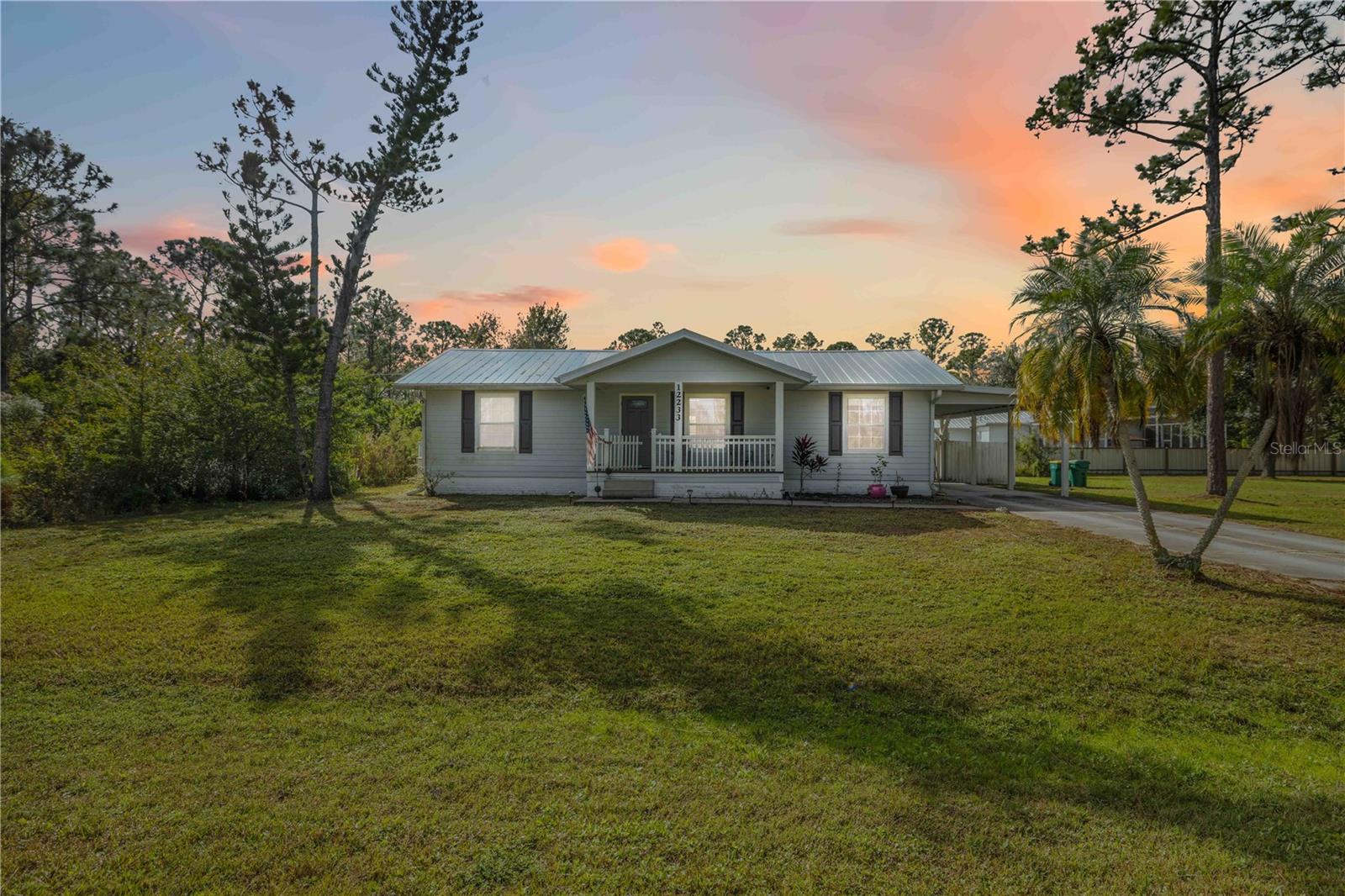 Single Family Residence em PUNTA GORDA, FL - Daniel Dourado