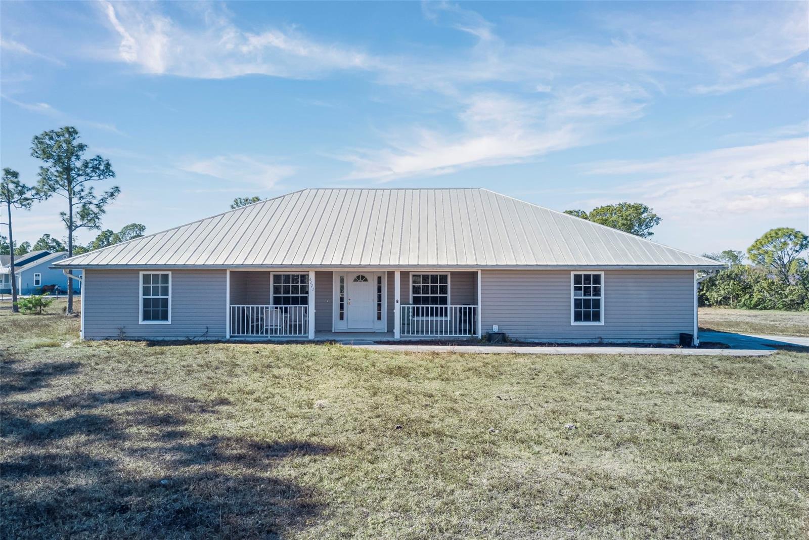 Single Family Residence em PUNTA GORDA, FL - Daniel Dourado