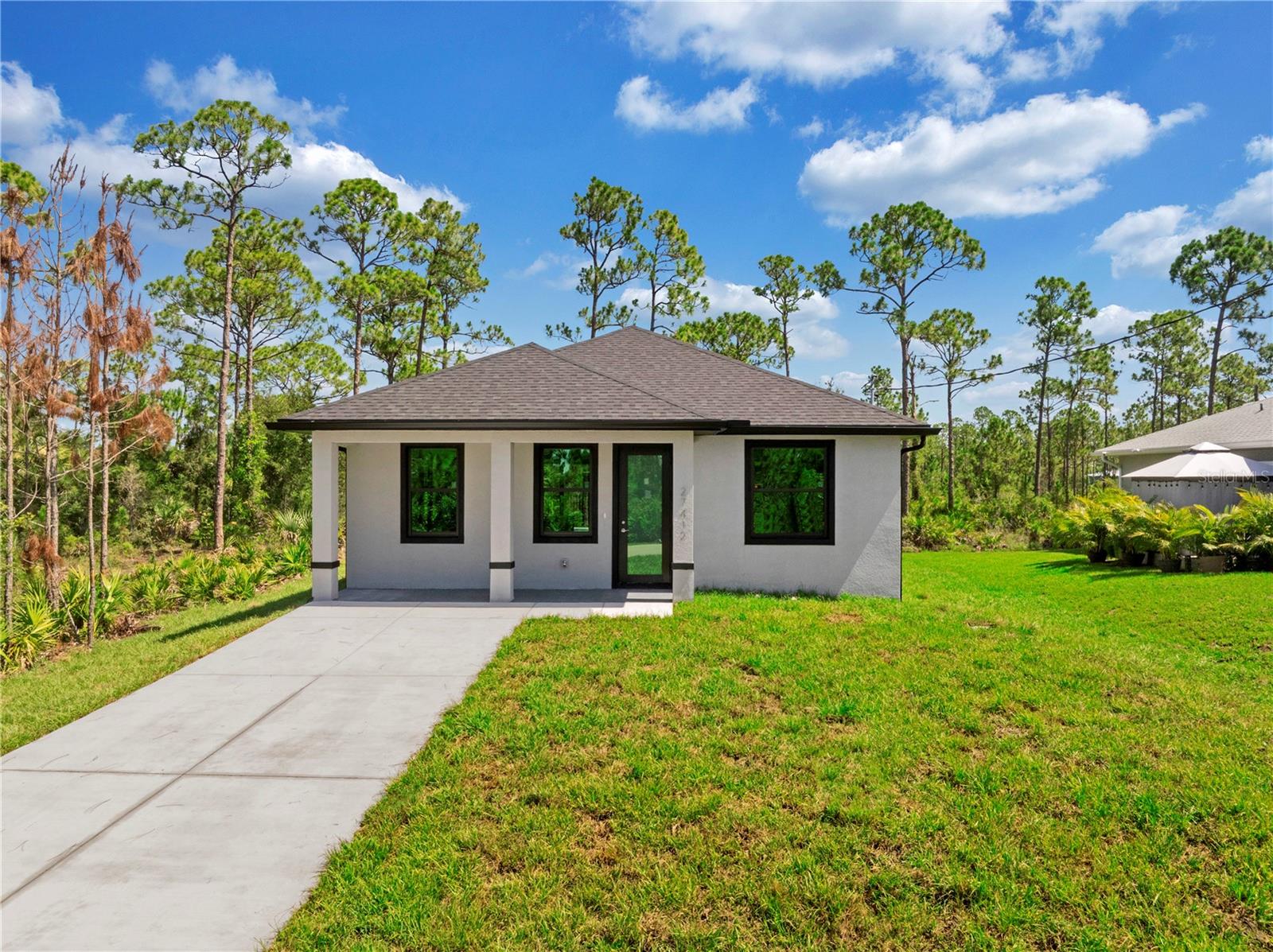 Single Family Residence em PUNTA GORDA, FL - Daniel Dourado
