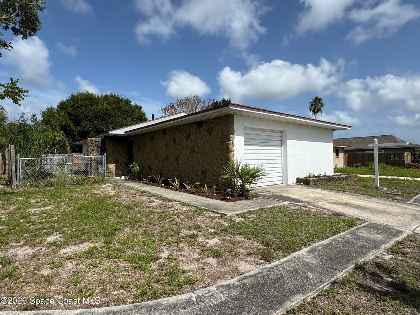 Single Family Residence in MERRITT ISLAND, FL - Daniel Dourado