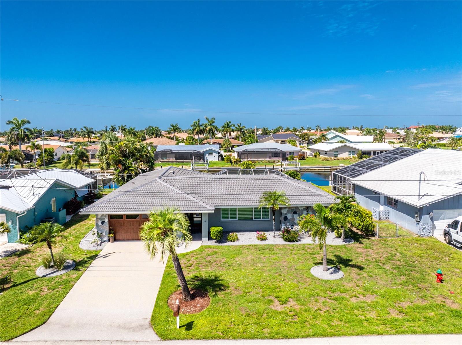 Single Family Residence em PUNTA GORDA, FL - Daniel Dourado