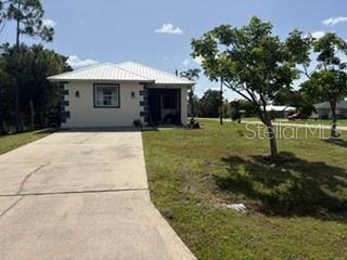 Single Family Residence em PUNTA GORDA, FL - Daniel Dourado